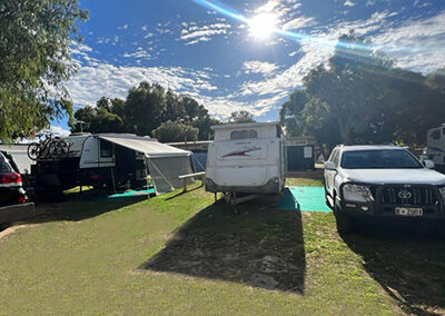 Bright sunny day on the parking area inside Esperance Pink lake Holiday Park